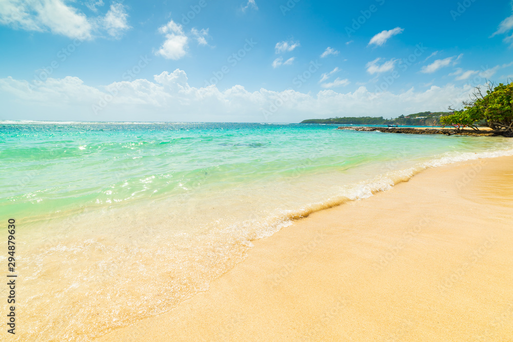 Golden sand and turquoise water in Guadeloupe