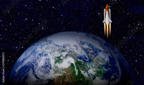 Space shuttle launch in the open space over the Earth. Elements of this image furnished by NASA