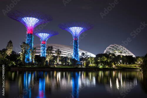 The supertrees and the cloud mountain water reflections view at night, Central Region, Singapore photo