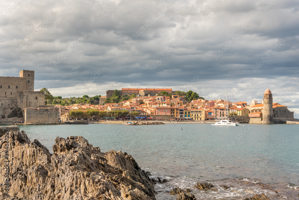 Collioure, France : 2019 Octobre 06 : People sunbathing on the beautiful beach of Collioure, France.