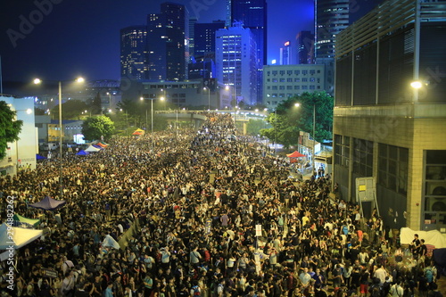 protesters raise up the mobiles in Admiralty government headquarters in 2014 photo
