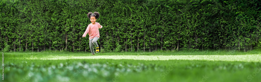 African black girl kid running on backyard with happy and fun African black girl kid running on backyard with happy and fun