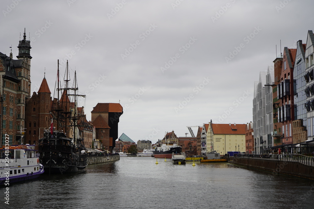 Gdansk, Poland - September 2019: A sightseeing ship floats on the river. Excursion ship sailing through the city’s water channels.