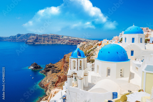 Panoramic shot of the Blue domed church at Oia Santorini Greece