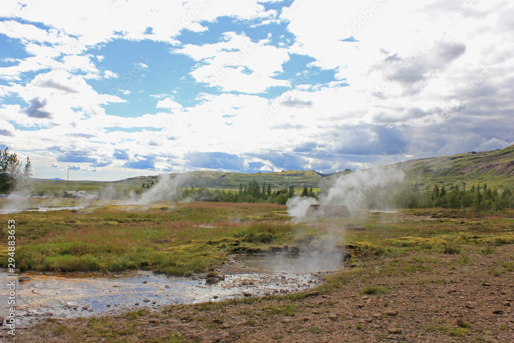 strokkur volcano in iceland with steam coming out of it strokkur volcano in iceland with steam coming out of it