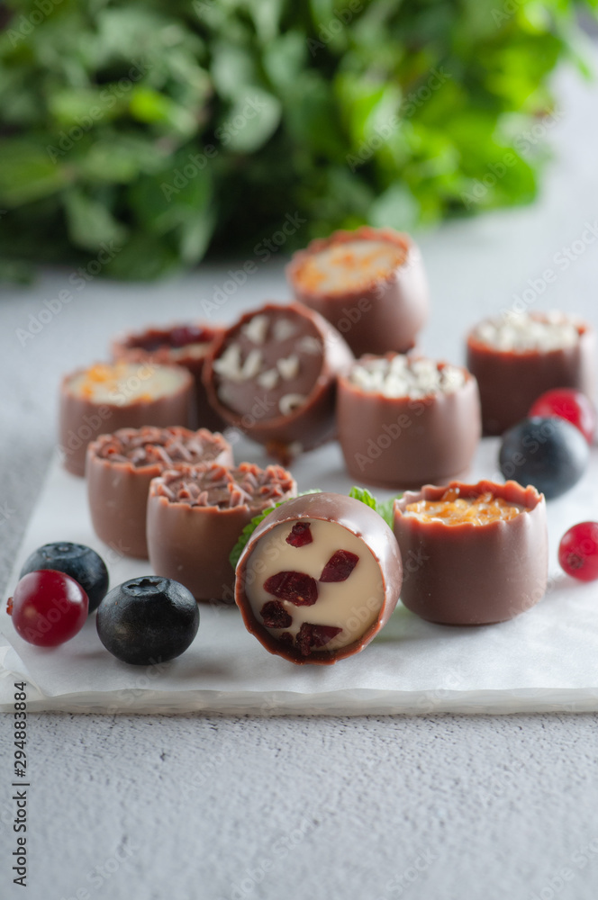 chocolates with different toppings and with mint and berries