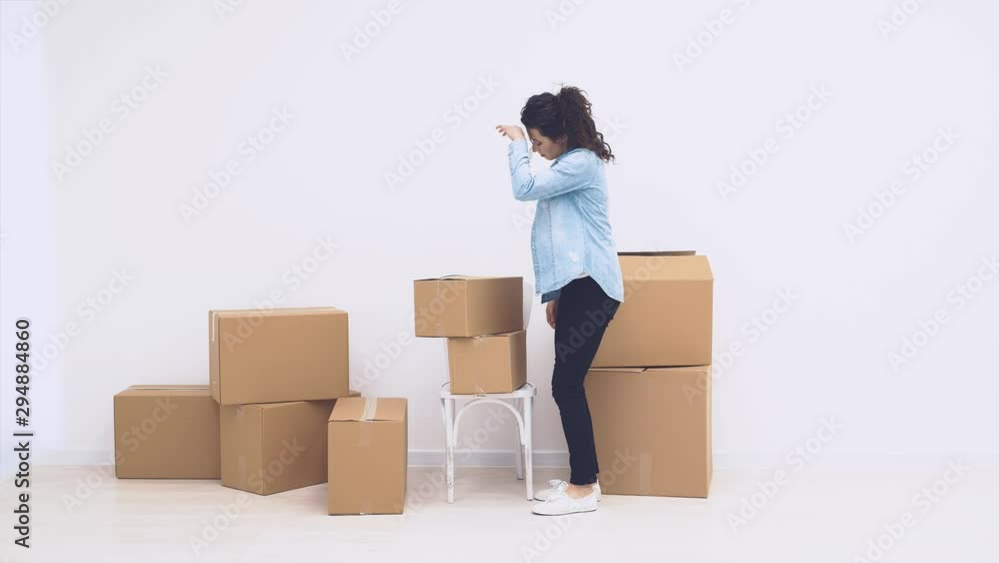 Strong woman is carring large moving boxes, full of items, isolated on white background. Copy space. Animation. Action. 4K. Strong woman is carring large moving boxes, full of items, isolated on white background. Copy space. Animation. Action. 4K.