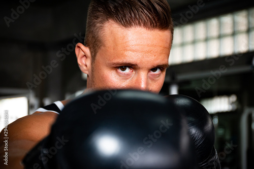 a sport people training and exercise in fitness gym by using weightlifing and dumbbell and boxing
