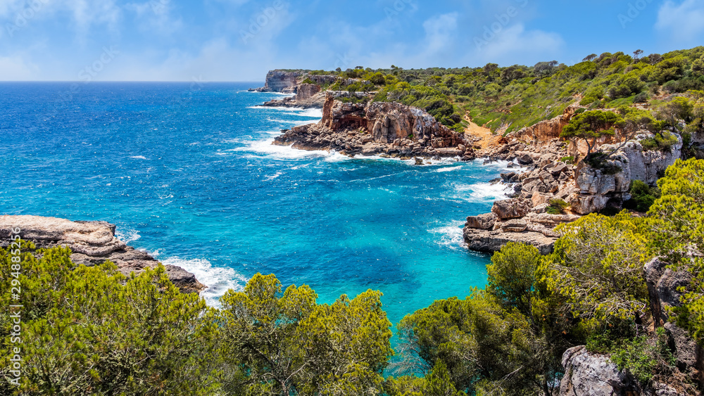 Panorama of beautiful beach and bay with turquoise sea water, Cala des Moro, Santanyi, Mallorca island, Spain