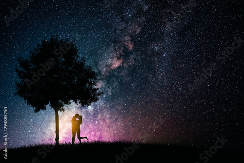 Couple love hug and kiss on night starry sky. Valentine's day and romantic design concept.