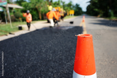 Workers repairing damaged roads (blurred images)