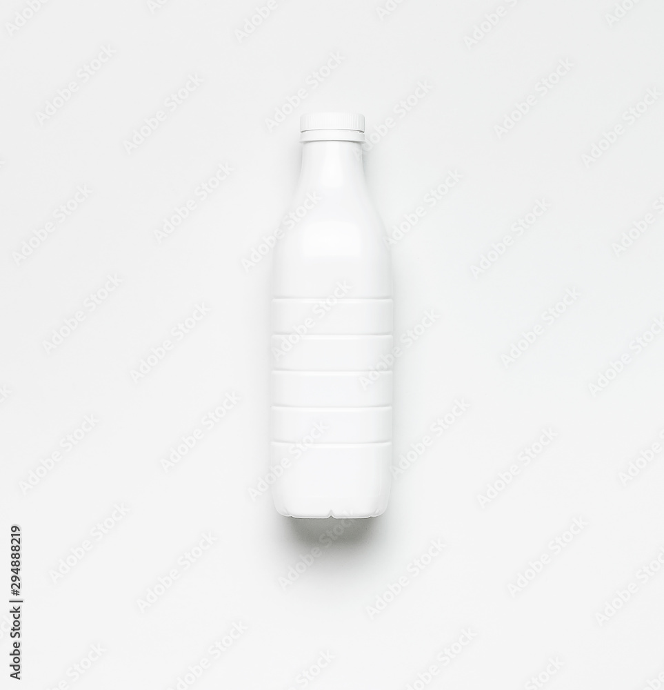 White plastic bottle containers for dairy products on light gray background top view flat lay. Plastic Kefir Yogurt Milk Bottle. Packaging template mockup. Layout for your design White plastic bottle containers for dairy products on light gray background top view flat lay. Plastic Kefir Yogurt Milk Bottle. Packaging template mockup. Layout for your design