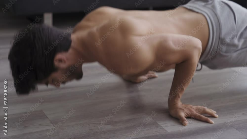 Young Fit Man Working Out at Home Reverse Hand Pushups Young Fit Man Working Out at Home Reverse Hand Pushups
