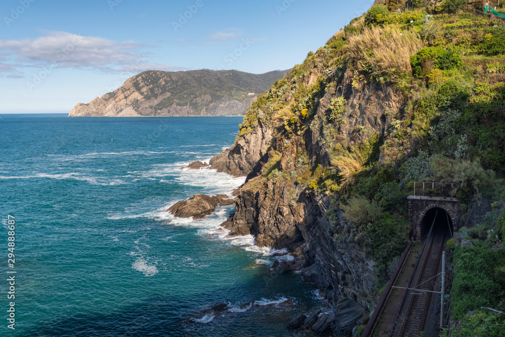 Aerial view of sea waves and fantastic Rocky coast and railway, Vernazza, Cinque Terre, Italy