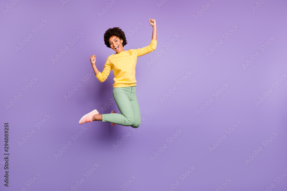 Full length body size view of her she nice attractive lovely funky girlish cheerful cheery wavy-haired girl celebrating jumping having fun isolated over violet purple lilac pastel color background
