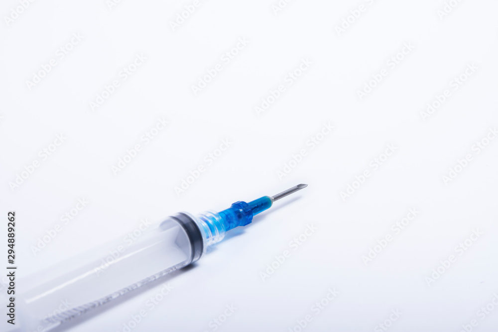 Syringes were placed on a white background in a diagonal direction. Syringes were placed on a white background in a diagonal direction.
