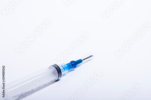 Syringes were placed on a white background in a diagonal direction.