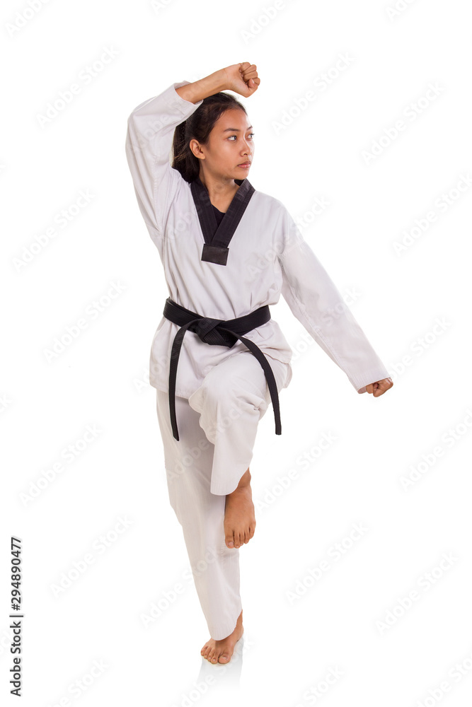 Female tae-kwon-do athlete making a pose full length Female tae-kwon-do athlete making a pose full length