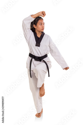 Female tae-kwon-do athlete making a pose full length