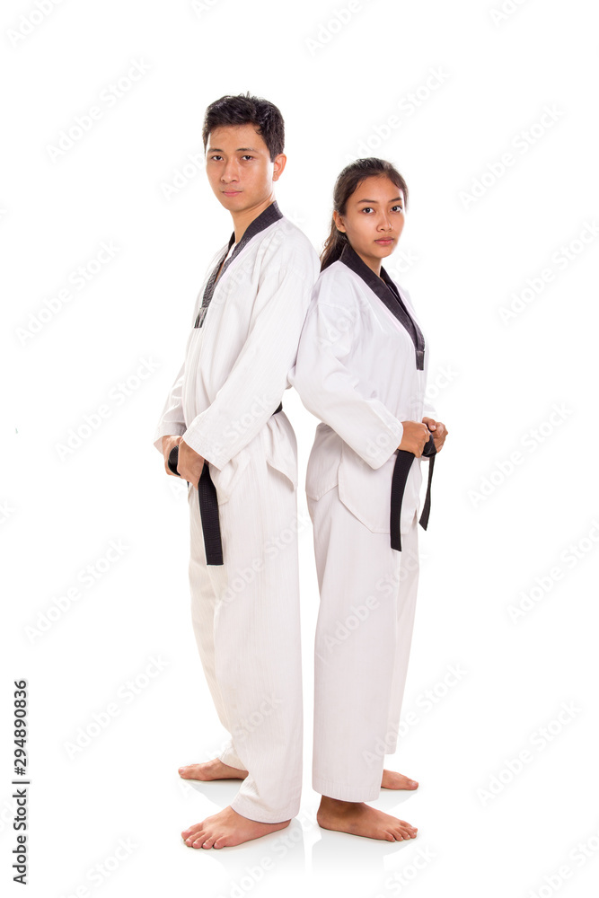 Taekwondo couple stand back at each other full length Taekwondo couple stand back at each other full length