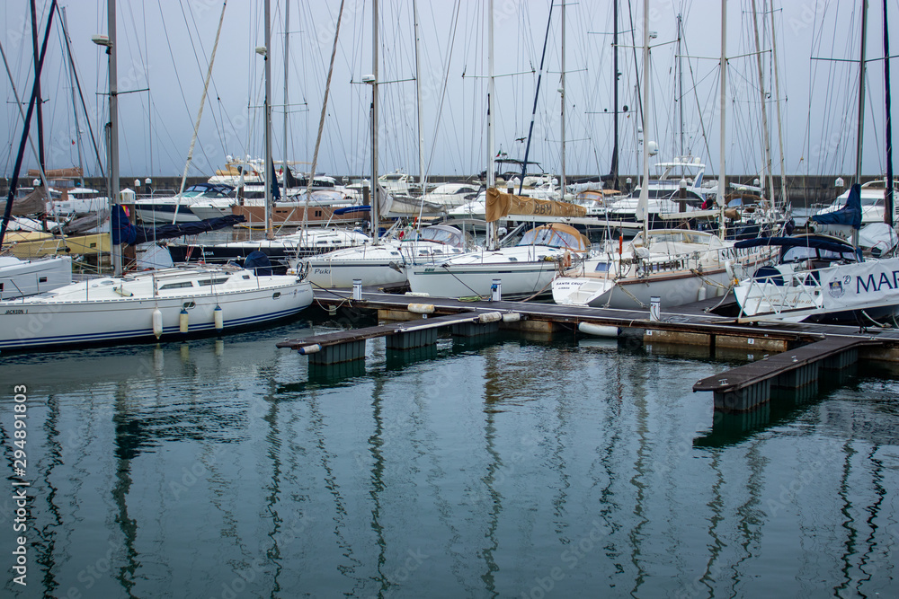 boats in marina with reflections in water, Cascais, Portugal
