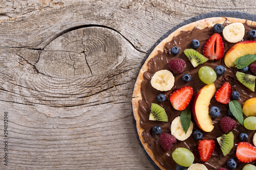 Fruit pizza with nut nougat cream   fruit and berries