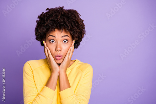 Photo of terrified stunned shocked girlfriend touching her cheekbones pouting her lips noticing her cheeks enlarged isolated over purple pastel color background © deagreez