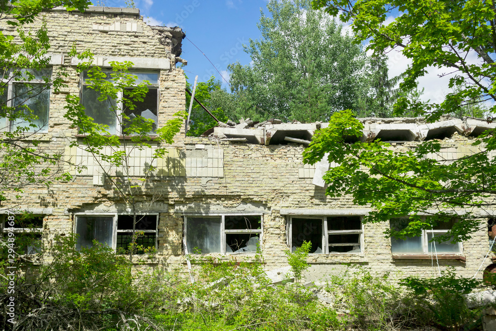 The ruins of residential buildings, the dark trash of collapsed houses as a result of the economic crisis and earthquake. The interior of the old buildings is destroyed.