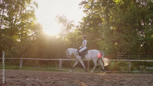 side view: Professional equitation from horsewomen