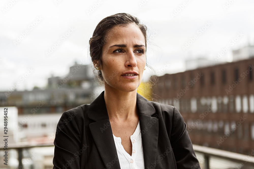 Mid adult woman in urban scene Mid adult woman in urban scene