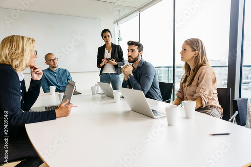 Businesspeople during meeting in conference room photo