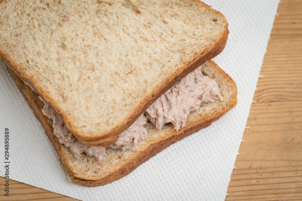 Tuna mayo sandwich with wheat bread.