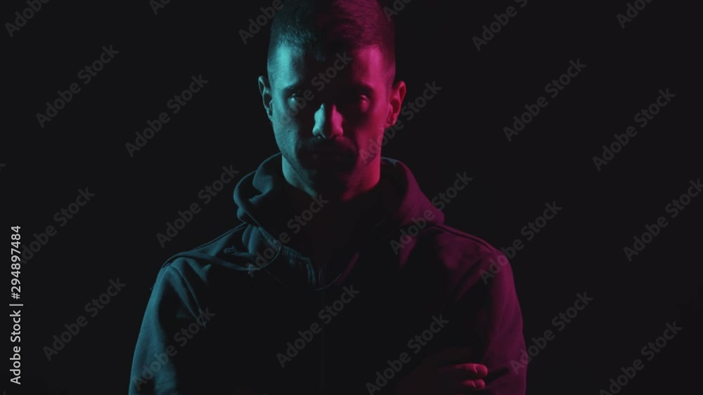 Portrait of computer hacker in hoodie. Obscured dark face. Data thief, internet fraud, darknet and cyber security . Portrait of computer hacker in hoodie. Obscured dark face. Data thief, internet fraud, darknet and cyber security .