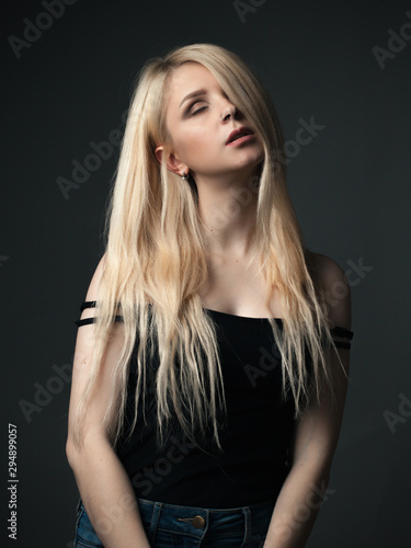 Studio portrait of young woman with beautiful long hair.