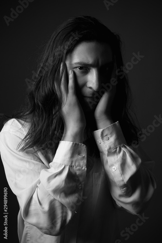 Fototapeta Naklejka Na Ścianę i Meble -  Unhappy man. Studio portrait. Black and white