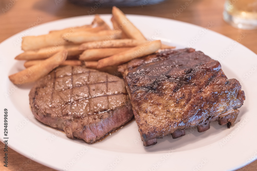 Rib eye Steak and Ribs with Potato Fries. Rib eye Steak and Ribs with Potato Fries.