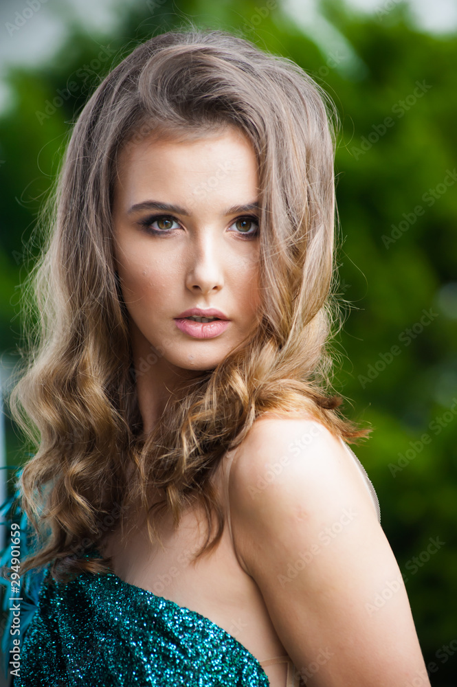 Portrait of beautiful woman in green evening dress Portrait of beautiful woman in green evening dress