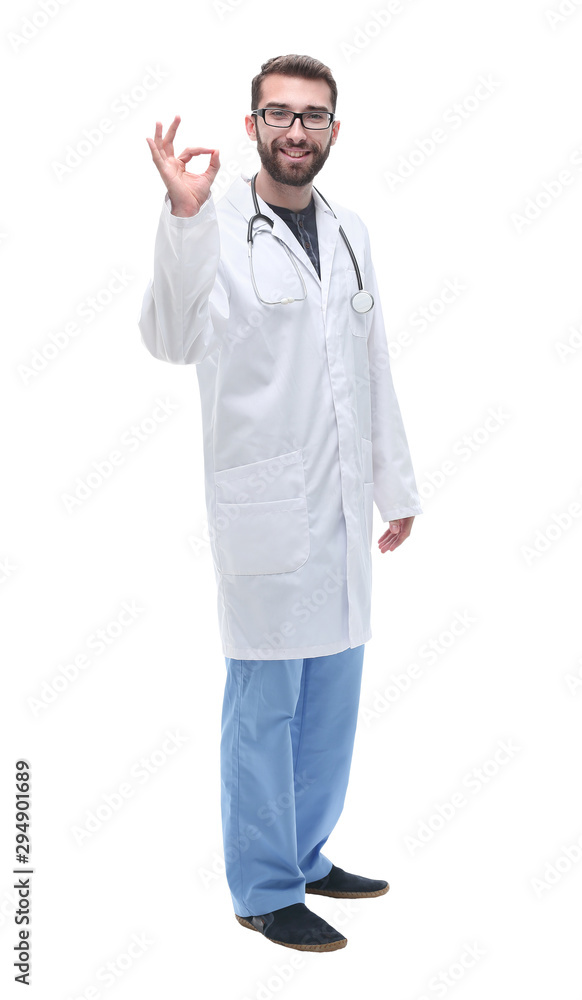 in full growth. qualified physician therapist showing OK gesture in full growth. qualified physician therapist showing OK gesture