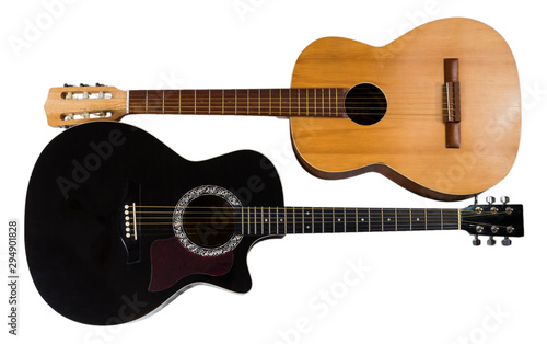 Two acoustic guitars, light and black. Isolated on white background.