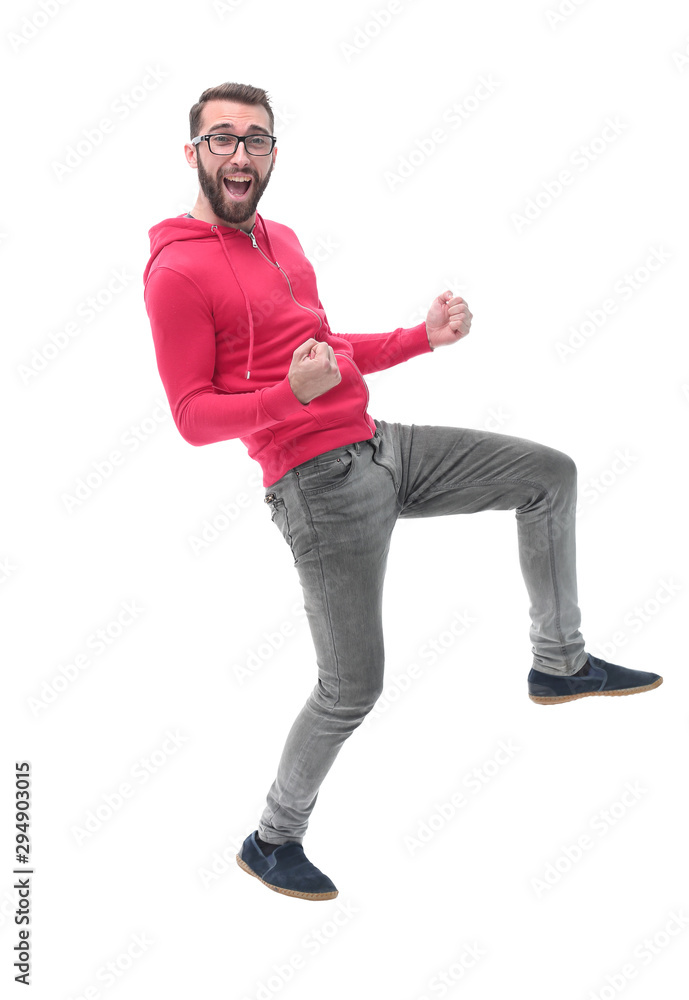Fototapeta premium in full growth. portrait of a happy modern guy.