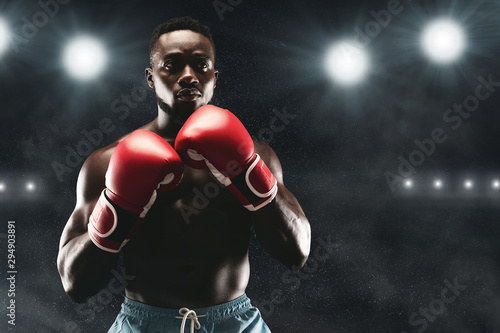 Confident african boxer standing in ready stance © Prostock-studio
