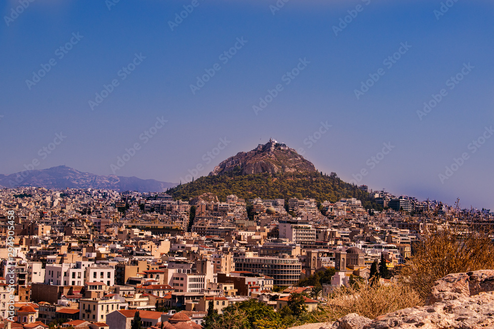 Beautiful landscape view of Athens, Greece on a sunny day with no clouds, with a big church in the center of the city