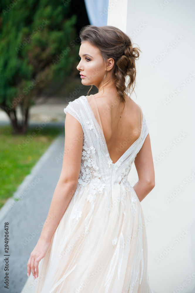 Beautiful bride with wedding flowers bouquet, attractive woman in wedding dress. Happy newlywed woman. Bride with wedding makeup and hairstyle. Smiling bride. Wedding day. Gorgeous bride. Marriage. Beautiful bride with wedding flowers bouquet, attractive woman in wedding dress. Happy newlywed woman. Bride with wedding makeup and hairstyle. Smiling bride. Wedding day. Gorgeous bride. Marriage.