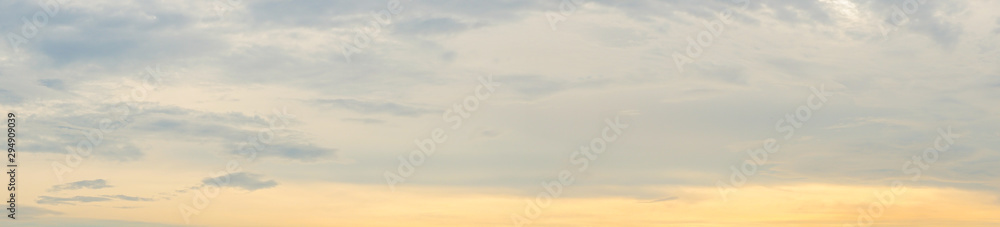 Panorama clear warm sky with white cloud background in the sunset time. warm light sky background.
