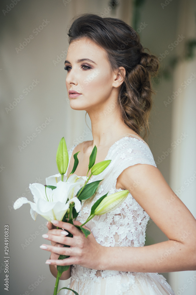 Portrait of bride in wedding dress with wedding bouquet Portrait of bride in wedding dress with wedding bouquet