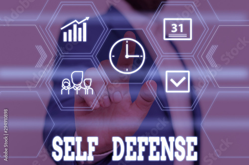 Writing note showing Self Defense. Business concept for the act of defending one s is demonstrating when physically attacked Male wear formal work suit presenting presentation smart device
