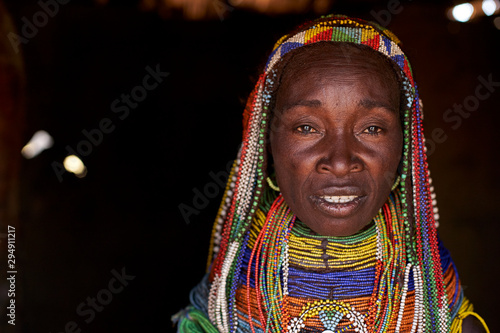 Portrait of Muhila woman with hairstyle and necklaces photo