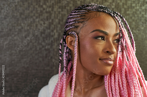 Portrait of young woman with pink braids photo