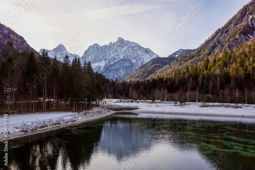 Winter landscape with lake and reflection . Italy Alps