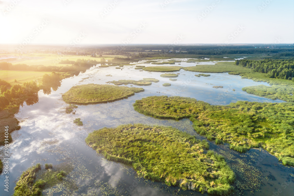 Beautiful aerial shot of a large forest lake. Beautiful aerial shot of a large forest lake.